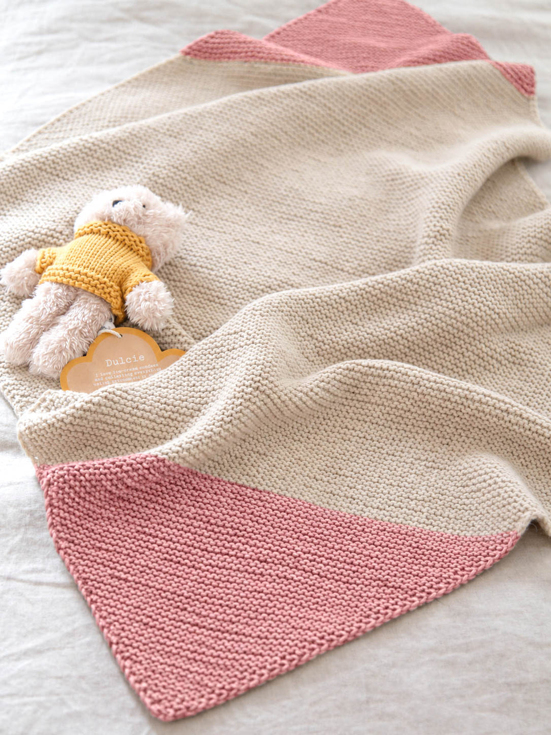 Colour Dipped Baby Blanket knitting pattern with garter stitch texture and contrasting corners