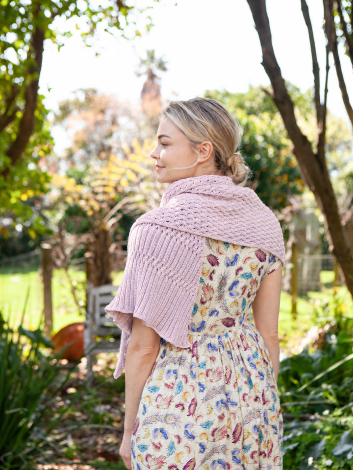 Euclid asymmetrical shawl with lattice cable and eyelet stitchwork and a deep ribbed border
